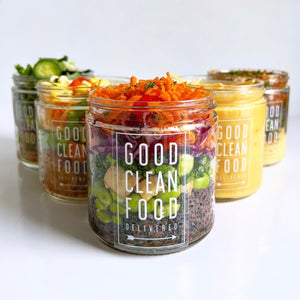 Jars of 'Good Clean Food' delivered on a white background